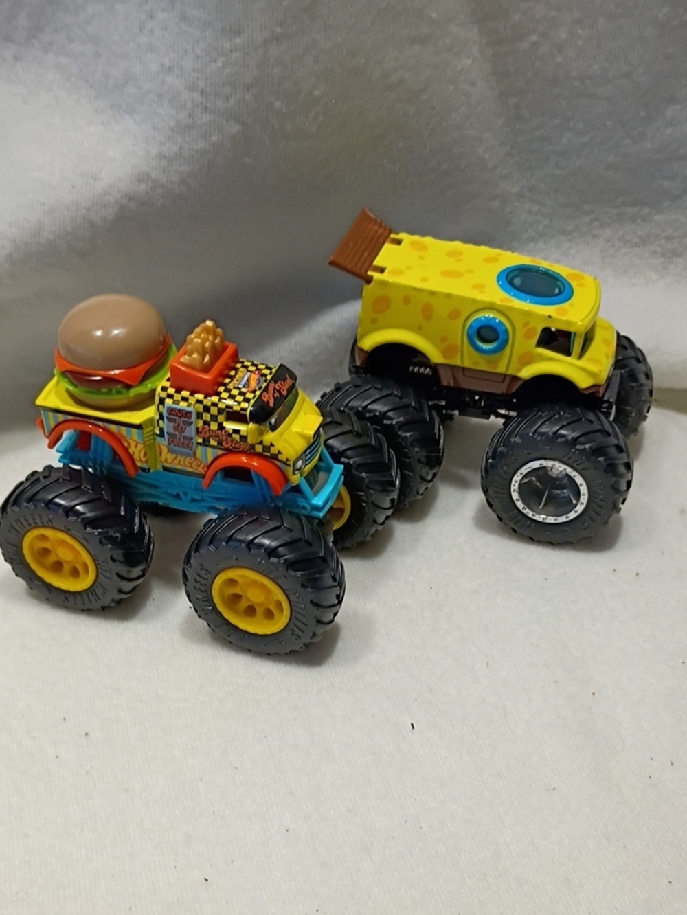 EUC Hot Wheels Monster Jam Set Of 2 Monster Trucks Sponge Bob And Buns Of Steel